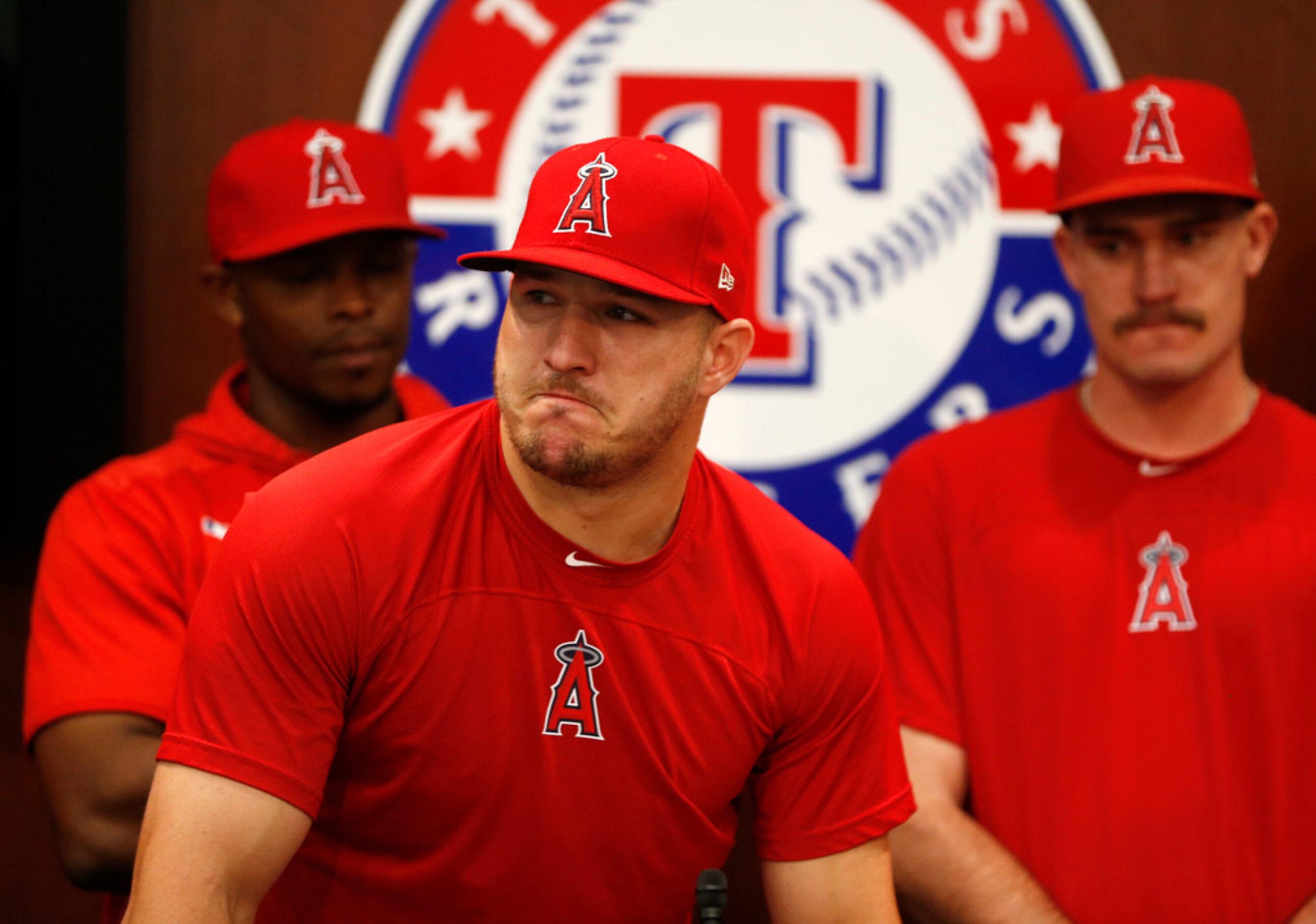 Los Angeles Angels center fielder Mike Trout (27) gets emotional as he talks about Los...