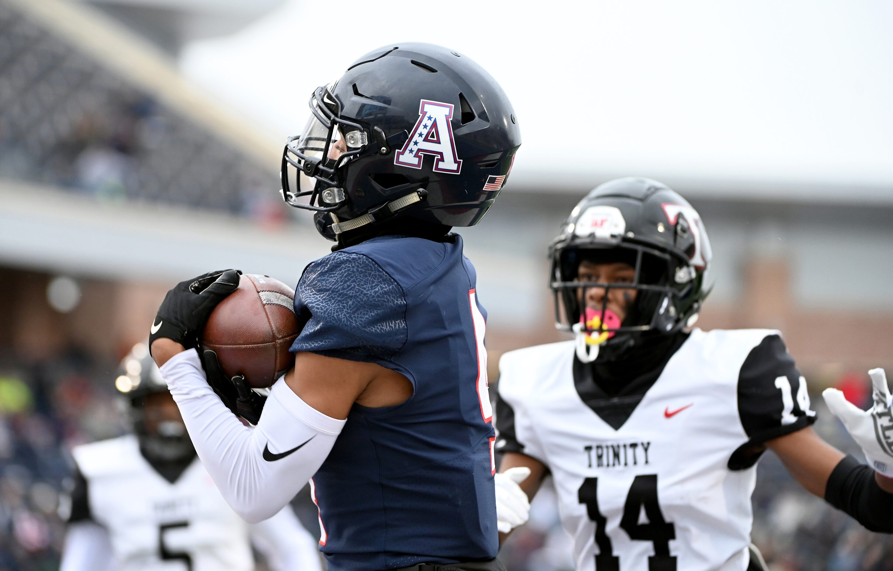 Allen's Jordyn Tyson (4) catches a touchdown pass in front of Euless Trinity's Alton Davis...