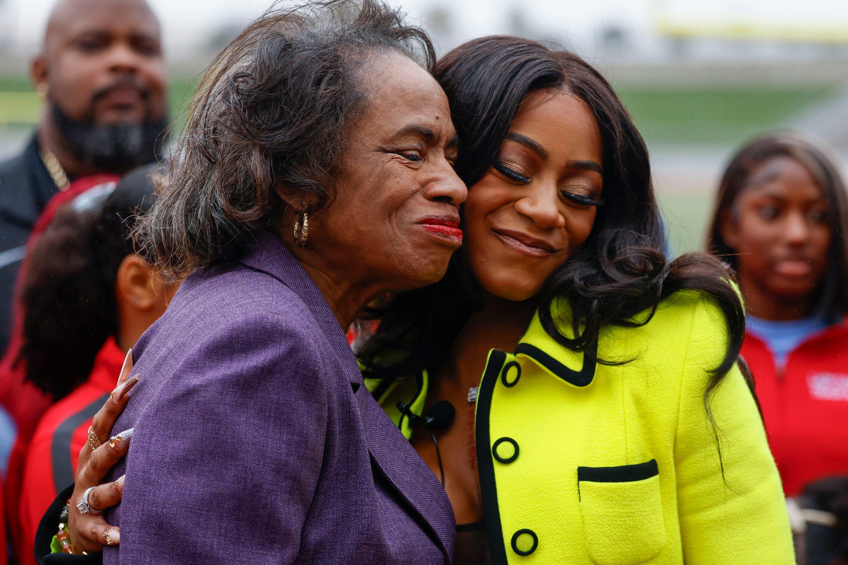 DISD trustee Joyce Foreman (left) embraces 100 meters world champion Sha'Carri Richardson,...