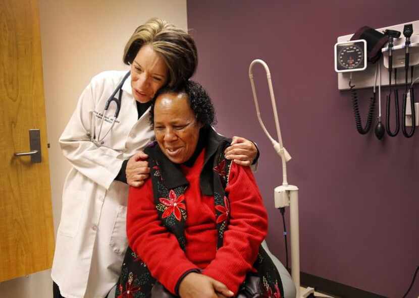 
Dr. Maria Robinson hugs patient Darline Henderson, 68, of West Dallas, who had kind words...