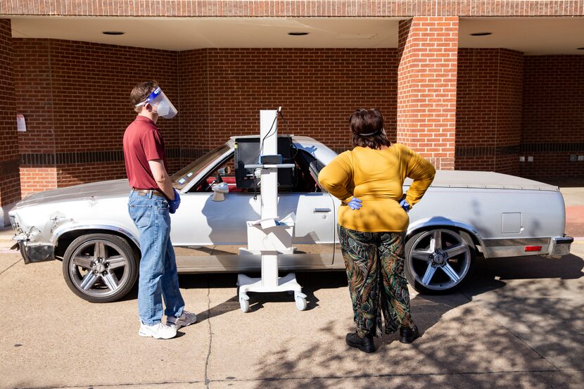 Curbside voting during the first day of early voting at Disciple Central Community Church in...