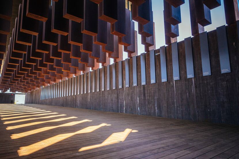 Eight hundred weathered steel columns, each one etched with the name of a lynching victim,...