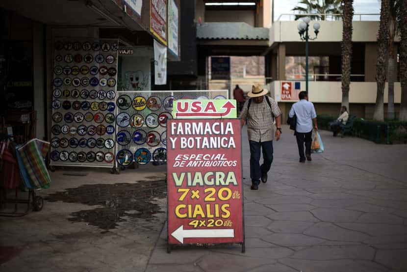 A sign outside a pharmacy in Tijuana, Mexico, entices American tourists with prescription...