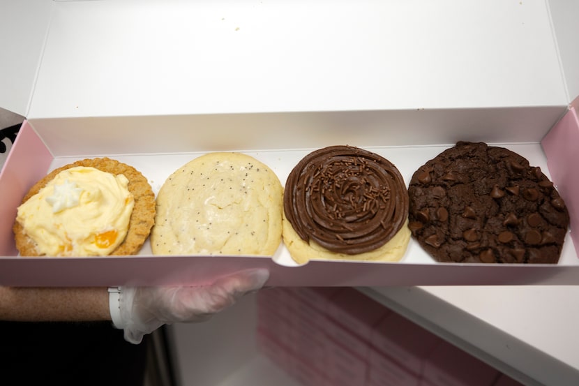 A four-pack box of Crumbl Cookies recently included (from left) peaches 'n cream, lemon...