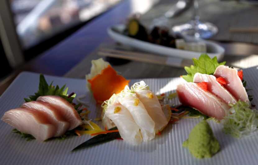 A trio of sashimi (albacore, snapper, hamachi) at Five Sixty by Wolfgang Puck. The albacore...