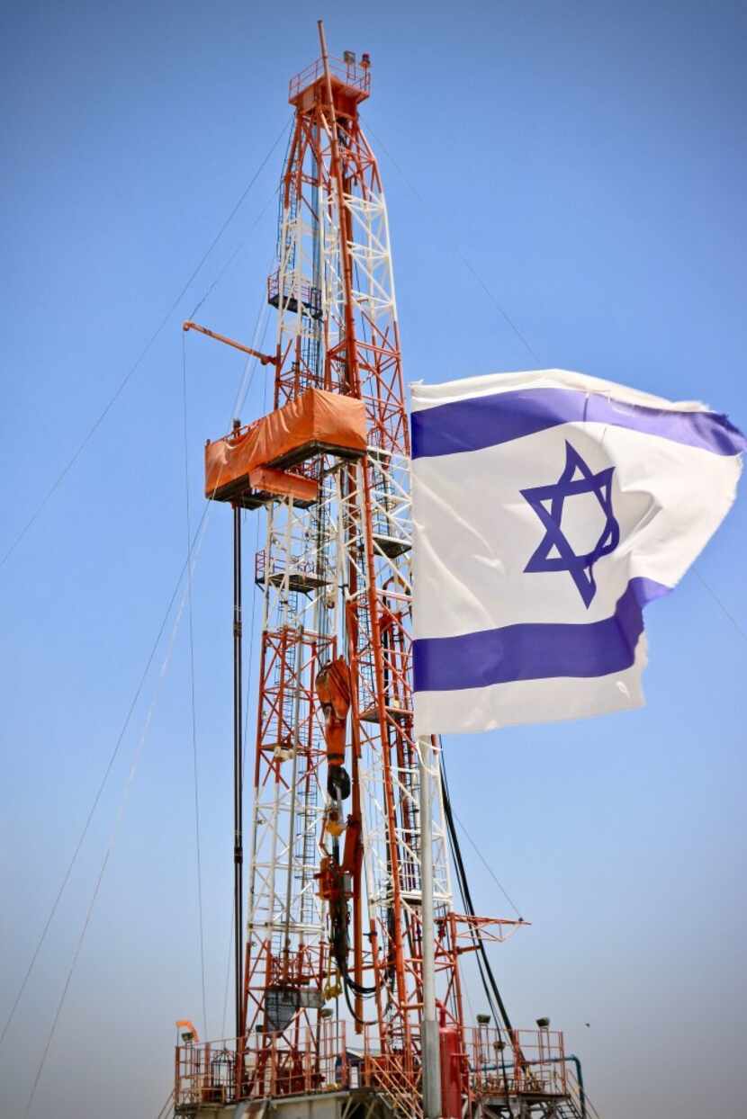 An Israeli flag flies next to the Megiddo-Jezreel #1 well. It is Dallas-based Zion Oil &...