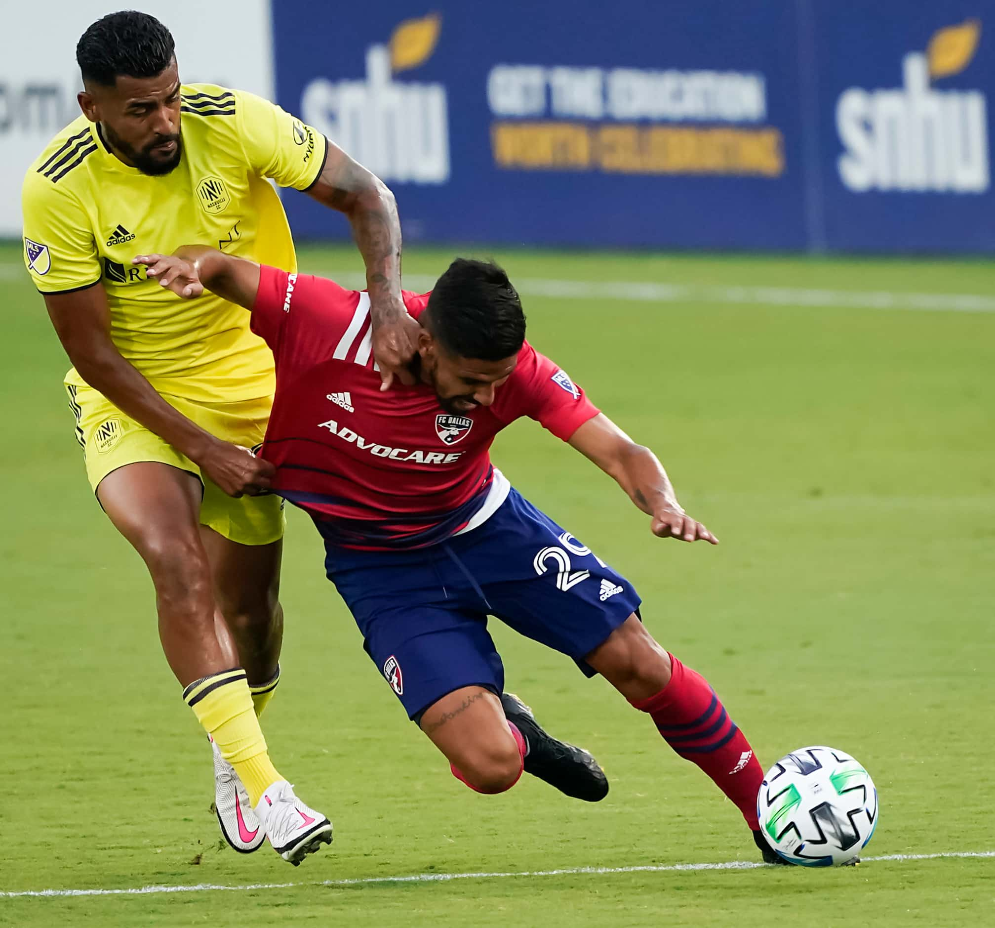 FC Dallas forward Franco Jara (29) is pulled down by Nashville SC midfielder Anibal Godoy...