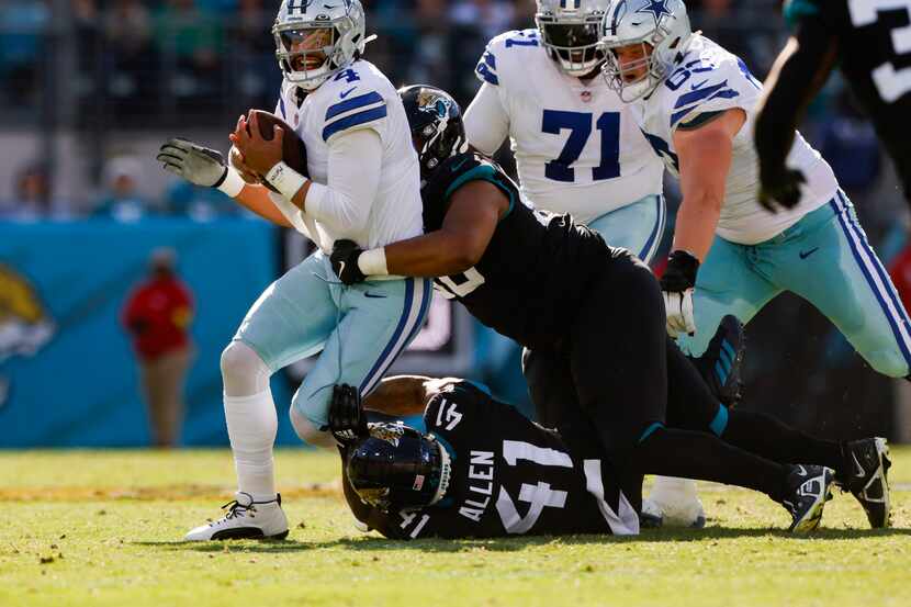 Dallas Cowboys quarterback Dak Prescott (4) is sacked by Jacksonville Jaguars linebacker...