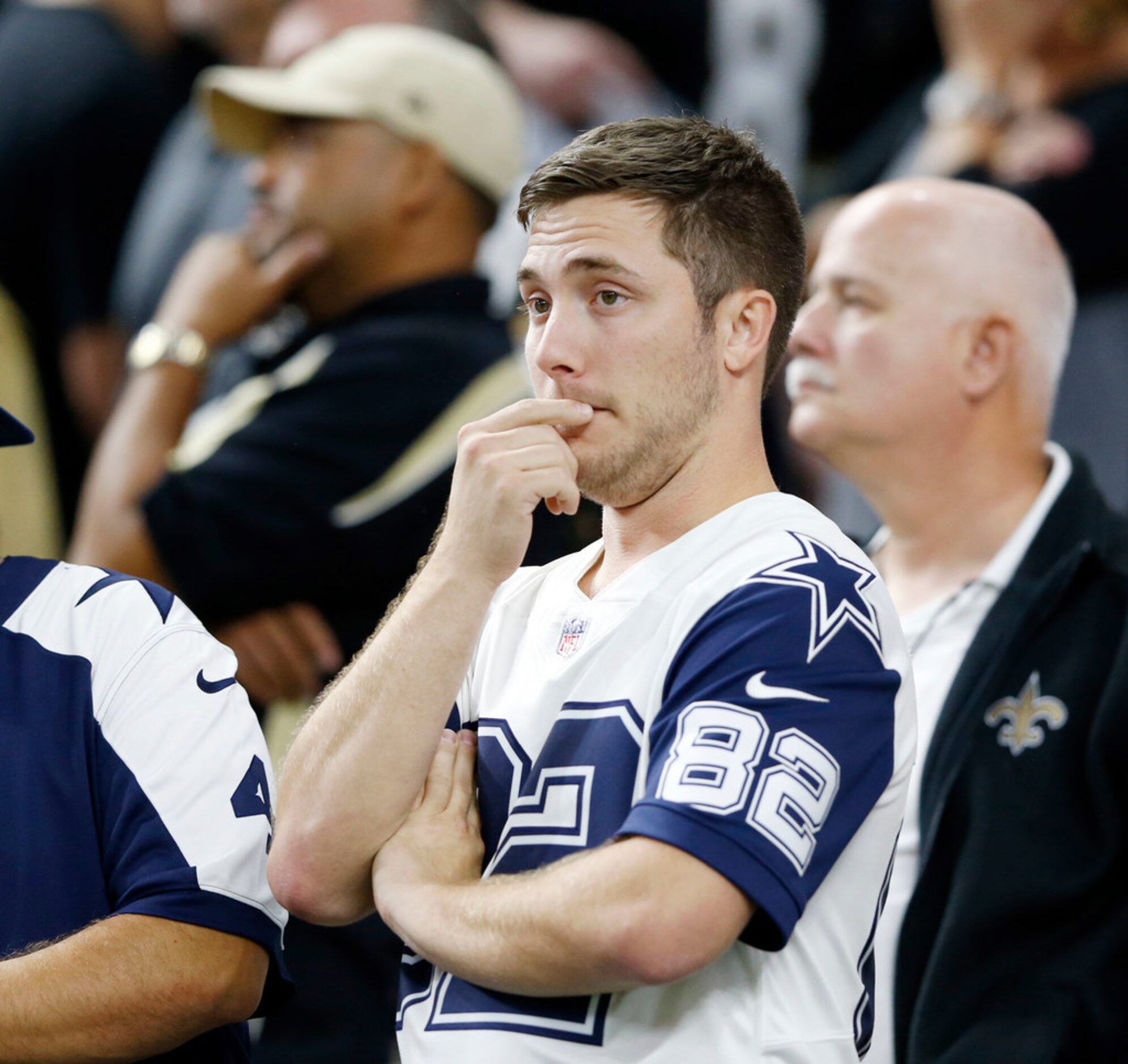 Dallas Cowboys fans watch anxiously in the final minute of play during the 4th quarter at...