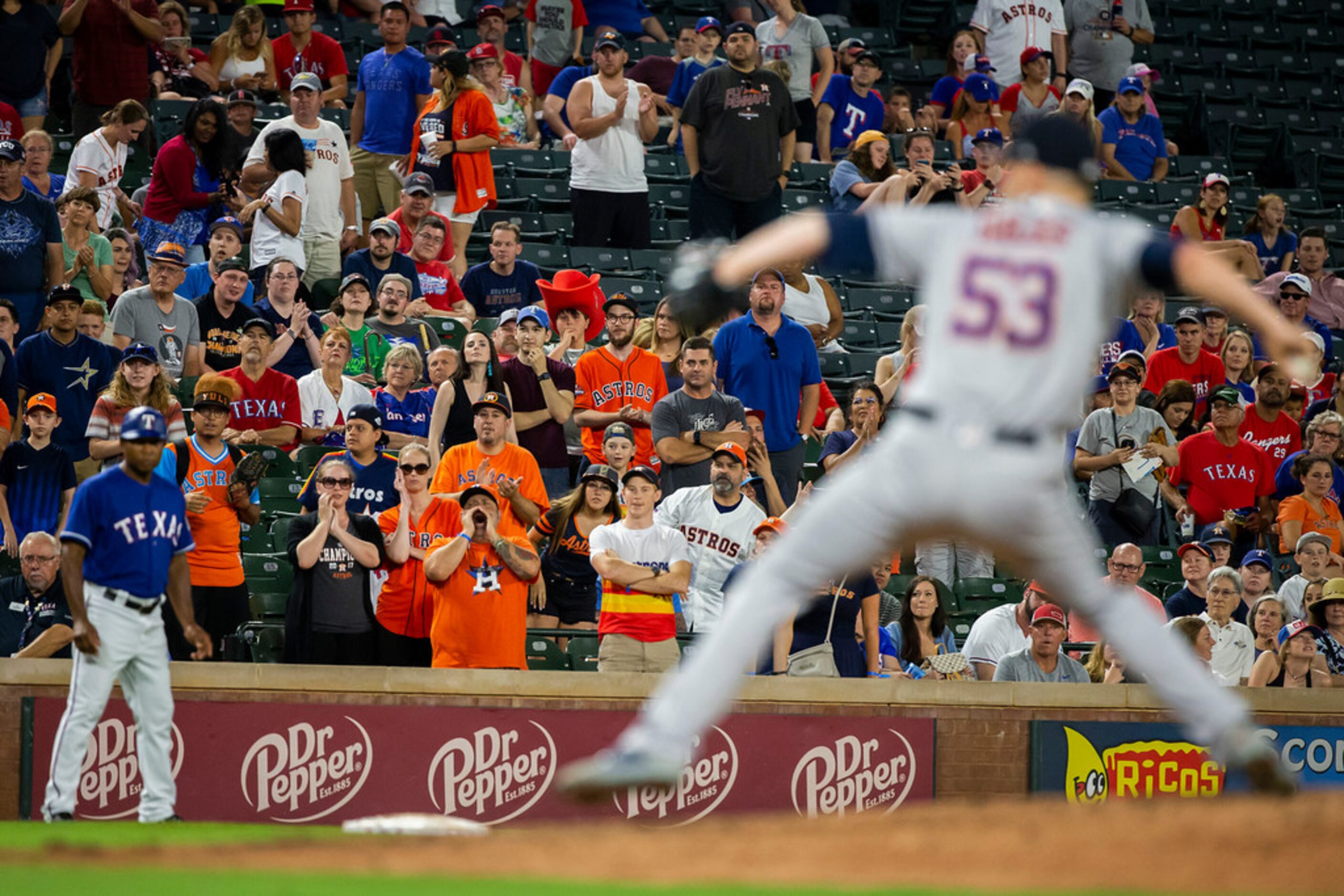 Houston Astros fans cheer as relief pitcher Ken Giles pitches during the ninth inning of a...