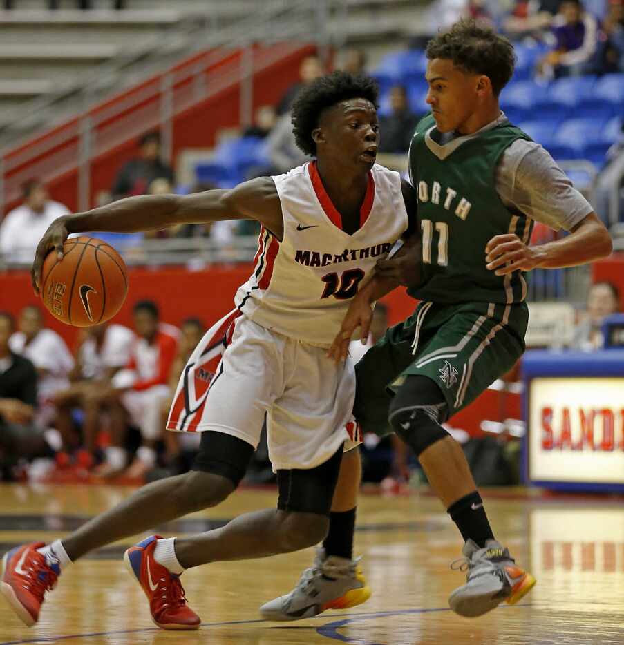 Irving MacArthur's Andrew Jones, left, is fouled by Norman North's Trae Young in the first...