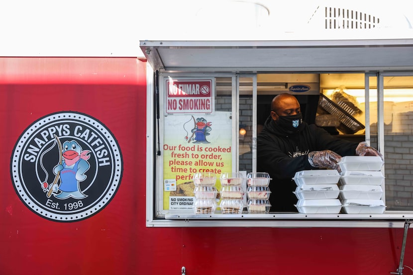 Terryon Jefferson gets food ready for school bus drivers at the Snappy Catfish.