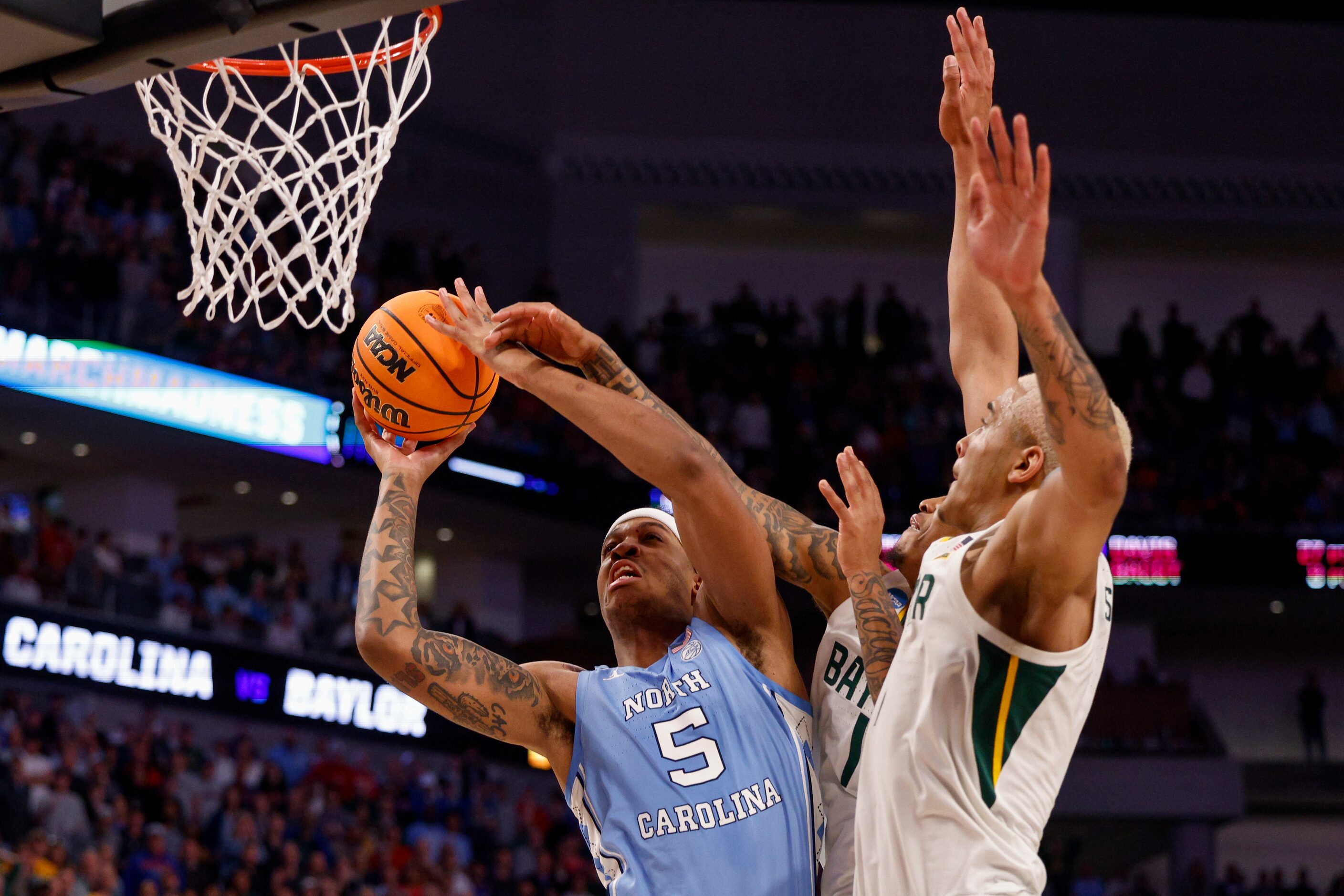 North Carolina Tar Heels forward Armando Bacot (5) drives to the basket against Baylor Bears...