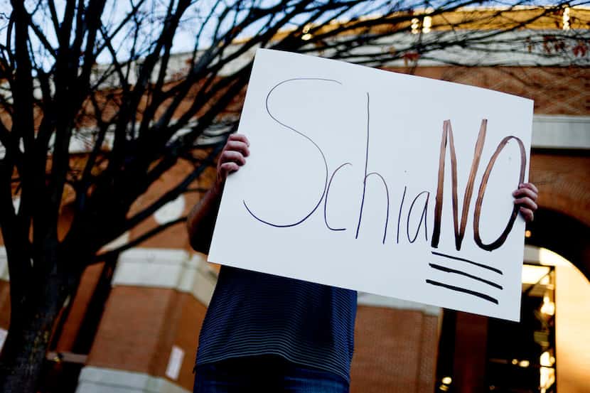 A Tennessee fan holds a sign reading "SchiaNO" during a gathering of Tennessee fans reacting...