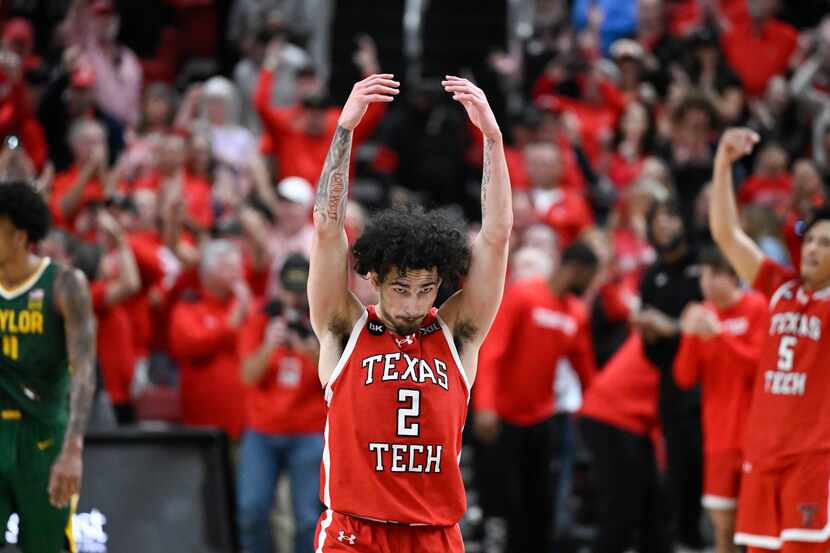 Texas Tech guard Pop Isaacs (2) encourages the crowd during the second half of an NCAA...