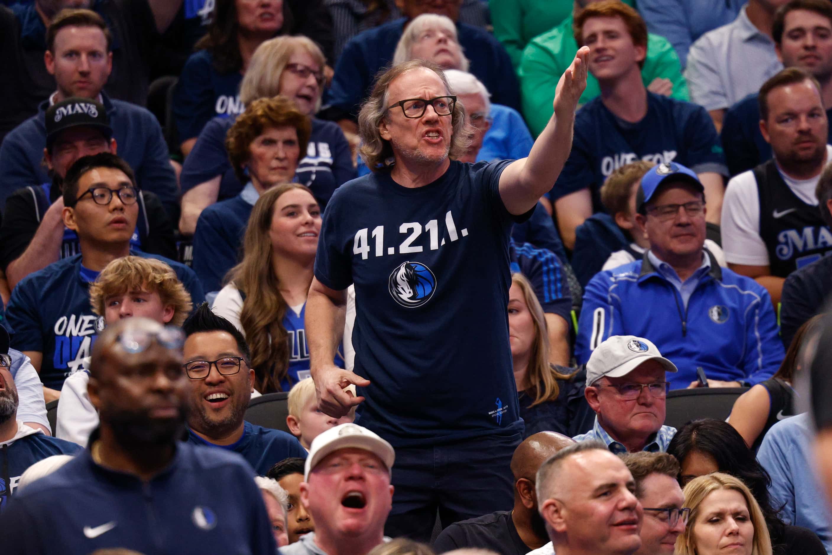A Dallas Mavericks fan calls for a foul during the second half of Game 3 of an NBA...