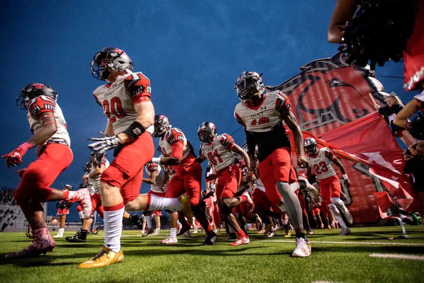 Mansfield Legacy takes the field before a high school football game against Lancaster,...