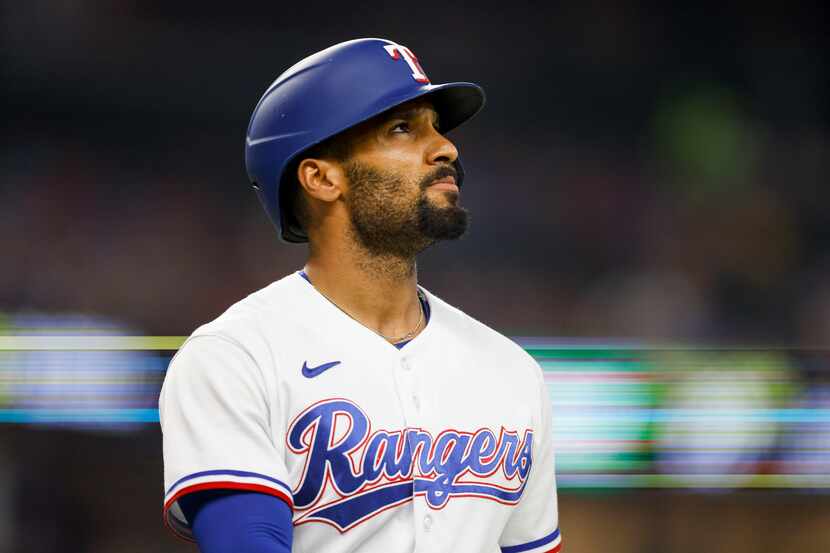 Texas Rangers second baseman Marcus Semien (2) looks to the scoreboard after striking out...