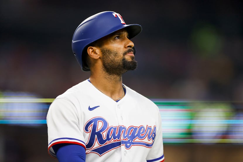 Texas Rangers second baseman Marcus Semien (2) looks to the scoreboard after striking out...