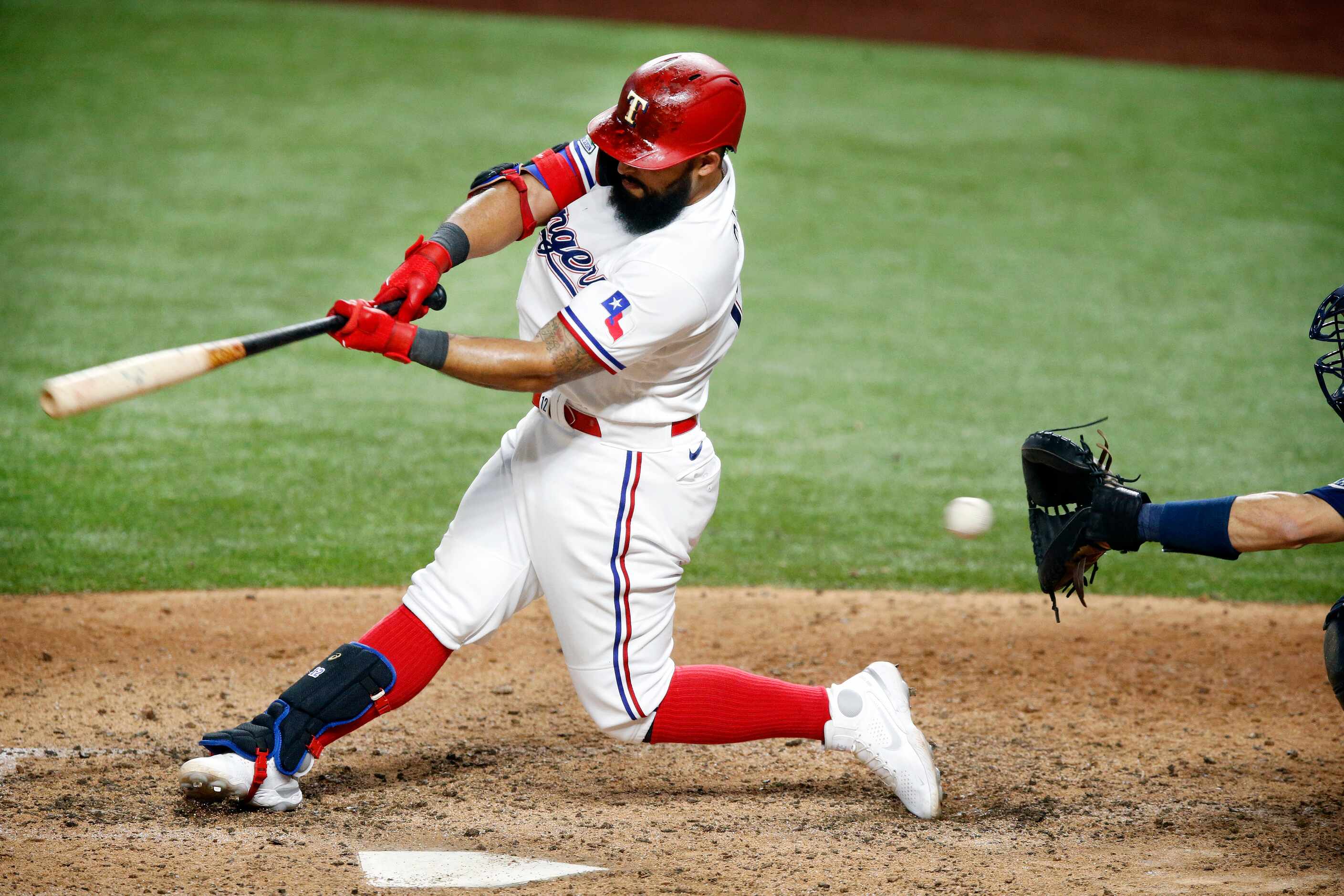 Texas Rangers second baseman Rougned Odor (12) strikes out swinging on a pitch by Seattle...