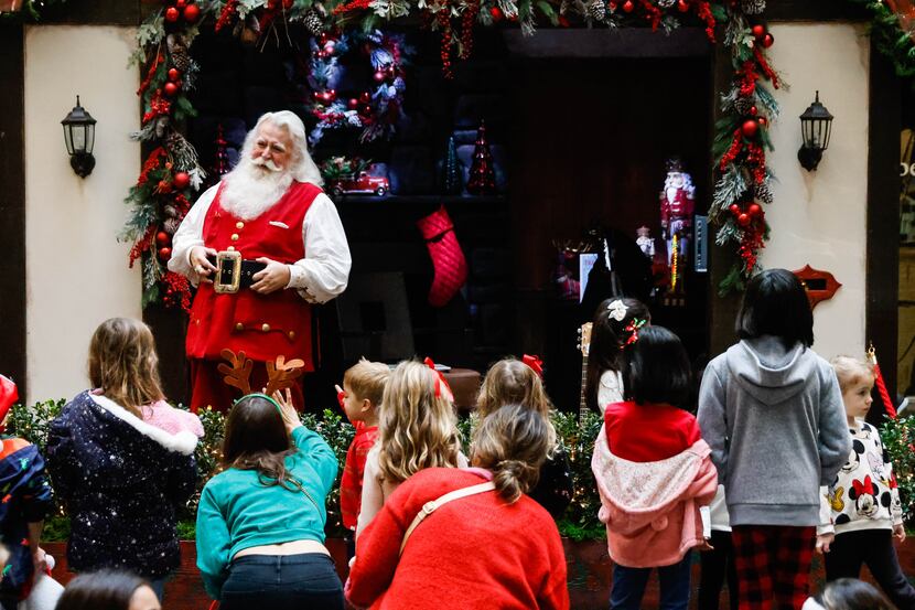 Joel Lagrone performs as Santa Claus at the NorthPark mall in Dallas on Sunday, Dec. 11, 2022.