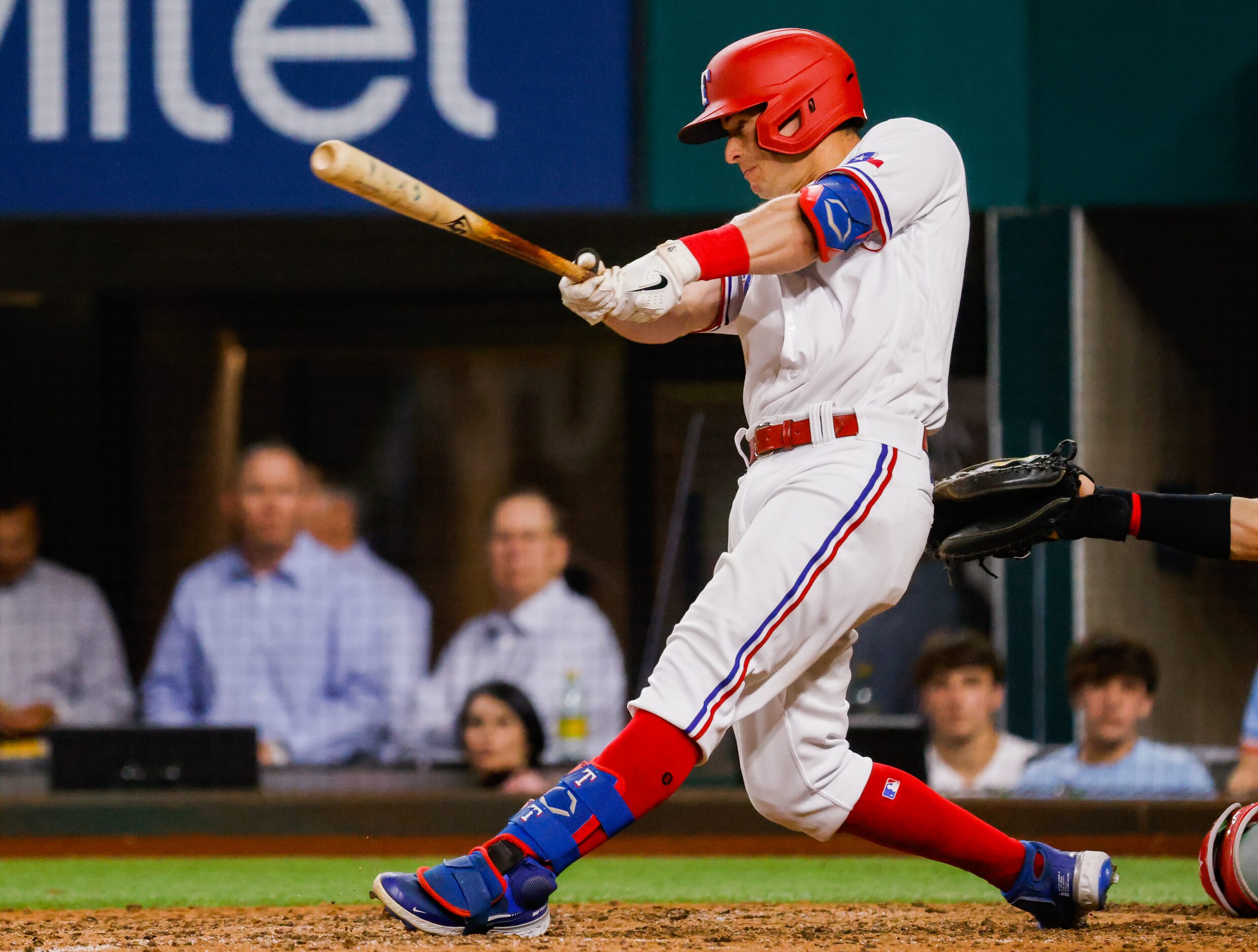 Texas Rangers second baseman Nick Solak (15) hits a homer on a fly ball to left field on a...