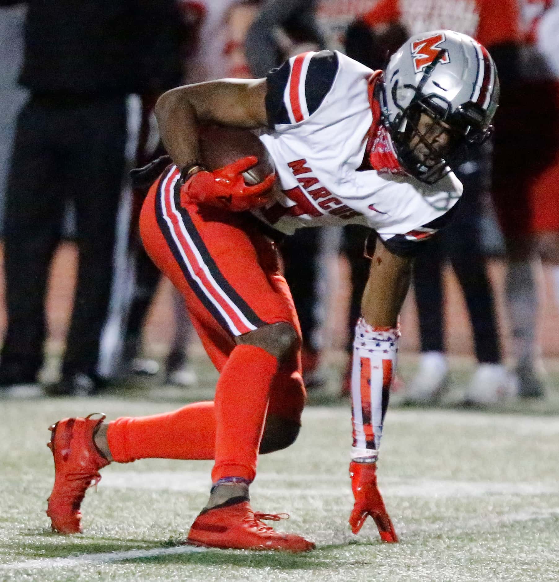 Flower Mound Marcus wide receiver J.Michael Sturdivant (7) keeps his balance for extra...