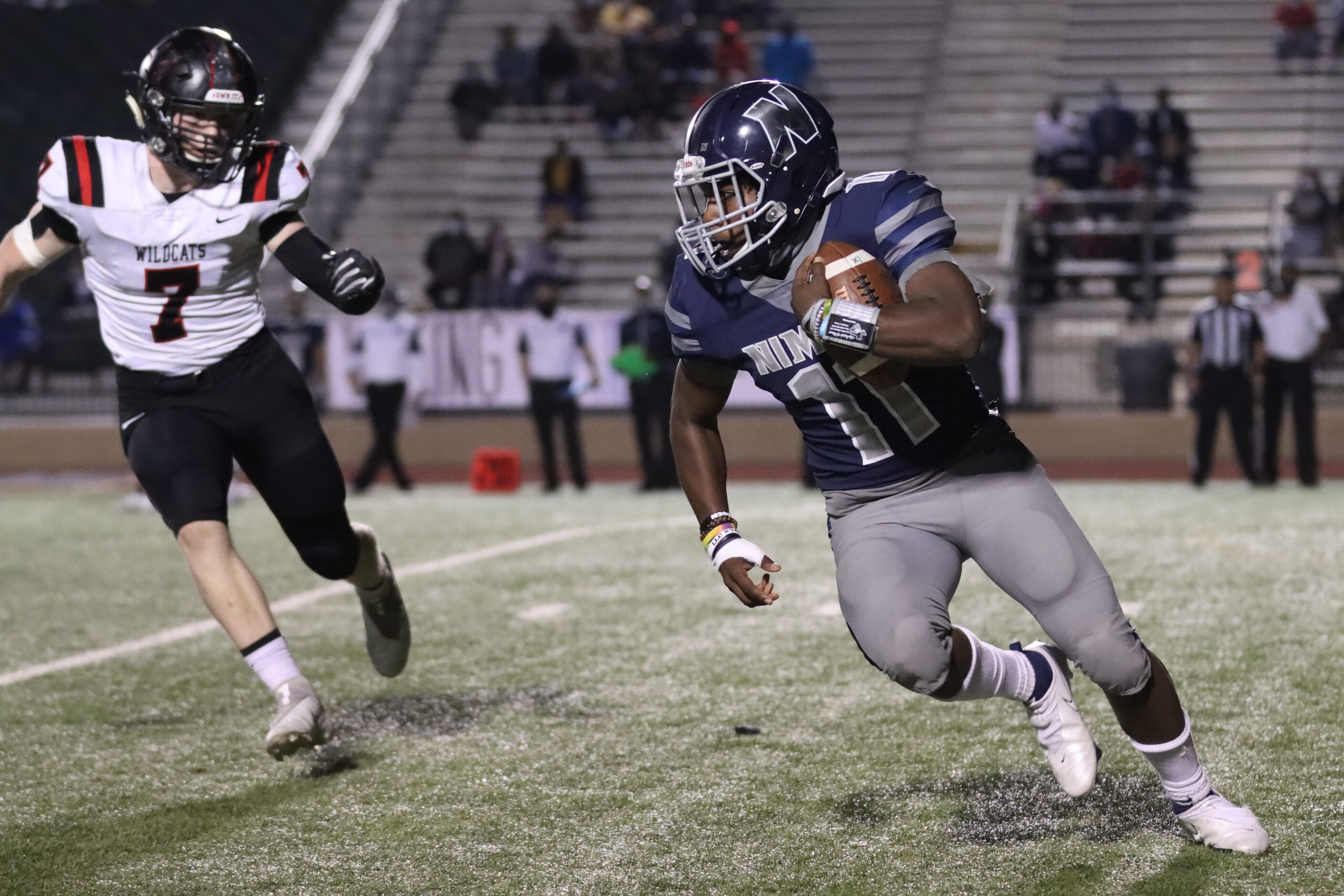 Irving Nimitz running back J’Den Hall (11) avoids Lake Highlands linebacker Luke Fairbanks...