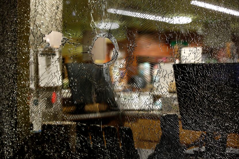 Vandals smashed out windows to the main entrance of Uptown's Whole Foods, as well as all of...