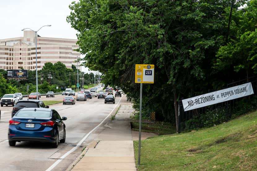 Signage opposing rezoning at Pepper Square shopping center on display along Preston Road...