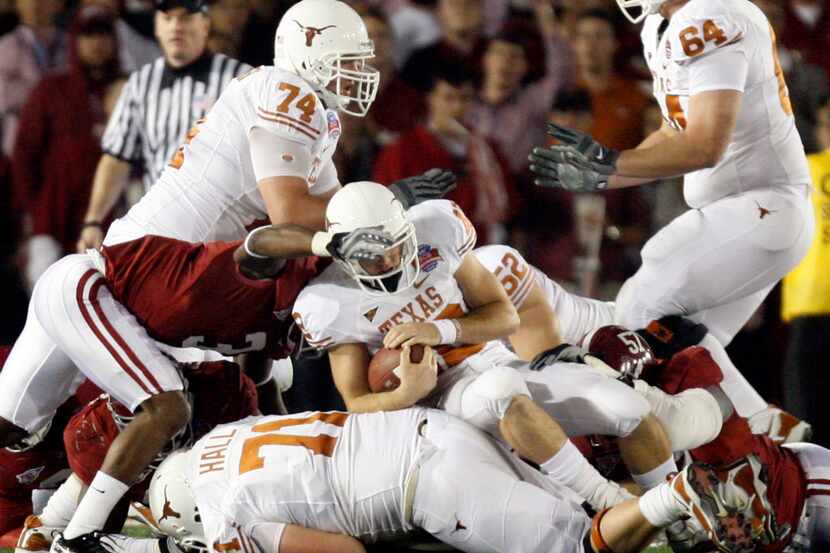 University of Texas QB Colt McCoy (12) is injured as he's hit by the University of Alabama...