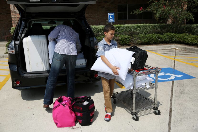 Samer (left) and Fawzia Adi Elsaadi sheltered with their four children after Harvey flooding...