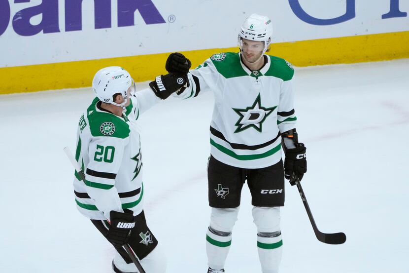 Dallas Stars' Colin Miller (6) celebrates his goal against the Chicago Blackhawks with Ryan...