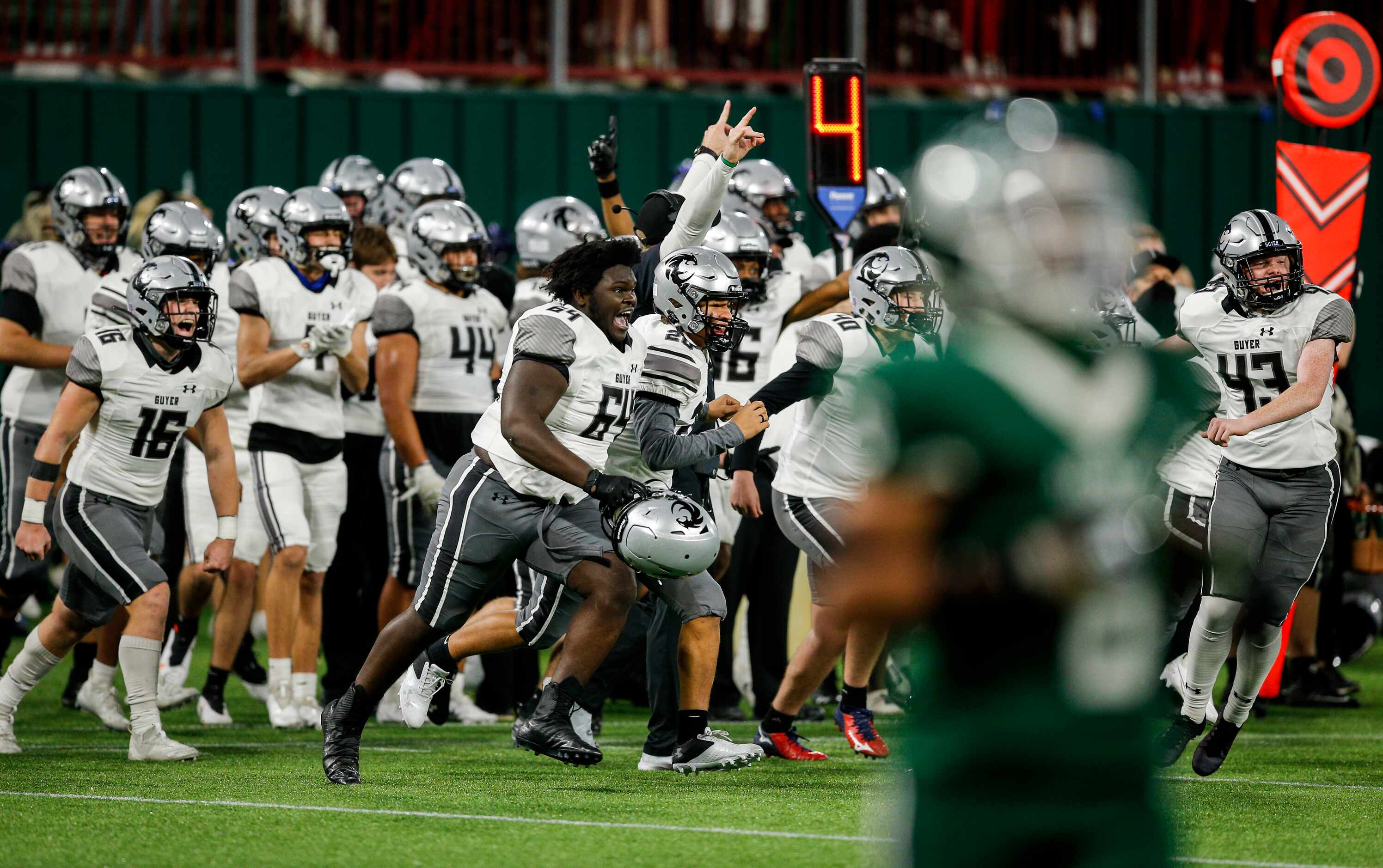 Denton Guyer celebrates a 38-31 double overtime win against Arlington after a high school...