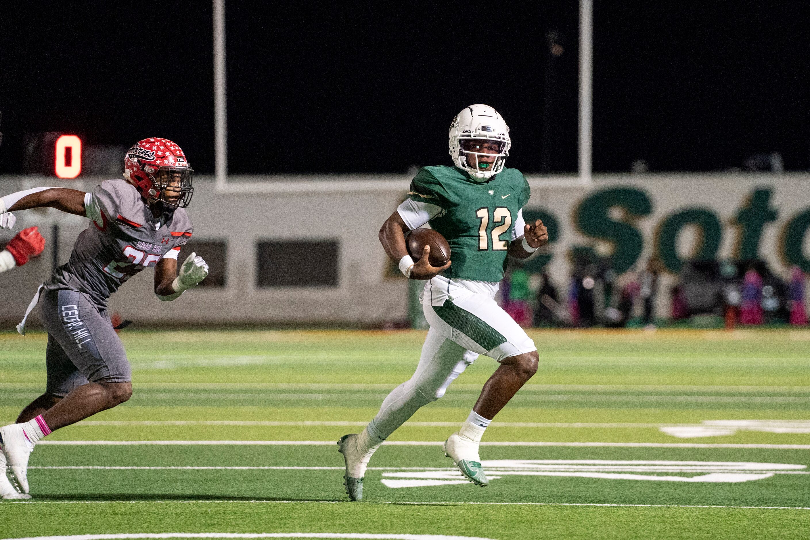 DeSoto senior quarterback Matt Allen (12) runs away from Cedar Hill junior linebacker...