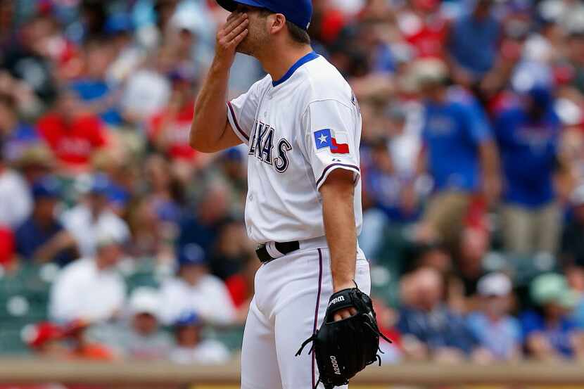 ARLINGTON, TX - APRIL 20:  Shawn Tolleson #37 of the Texas Rangers reacts after Marcus...
