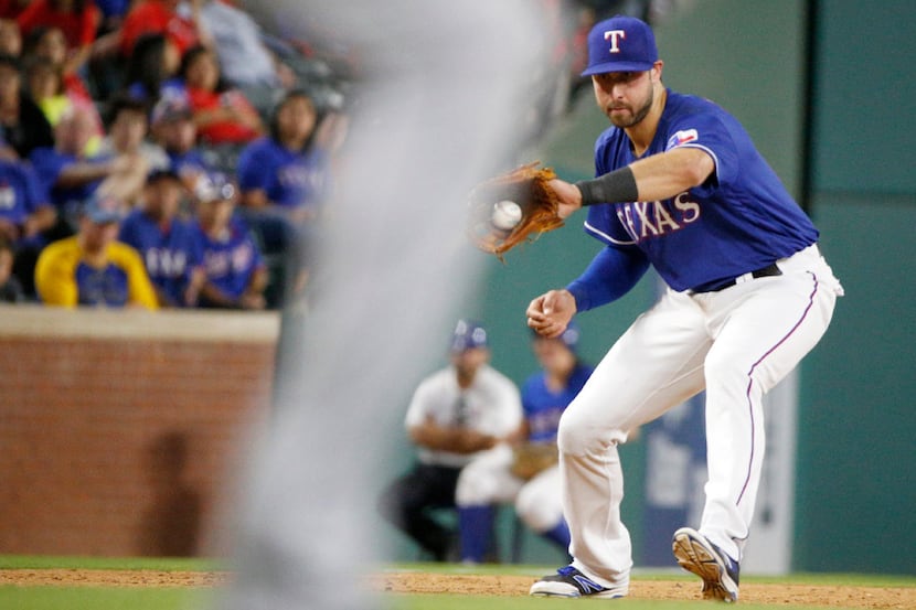 Texas Rangers designated hitter Joey Gallo (13) fields a hit by Tampa Bay Rays at Globe Life...