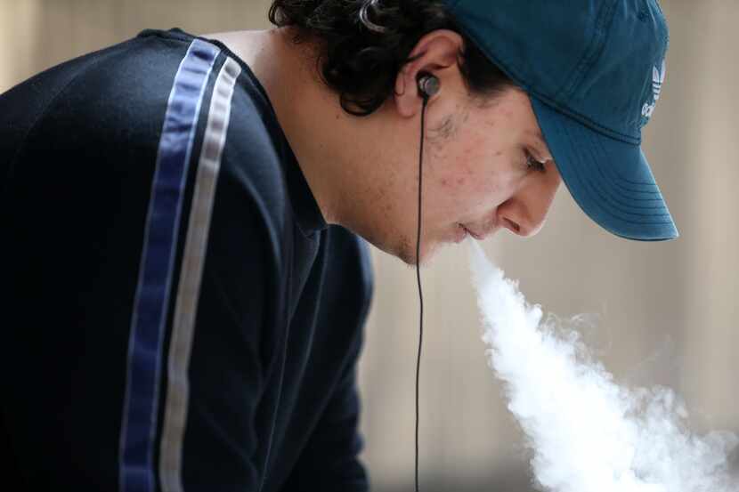 Aubrey Williams, 19, vapes outside El Centro College in downtown Dallas on Monday, March 18,...