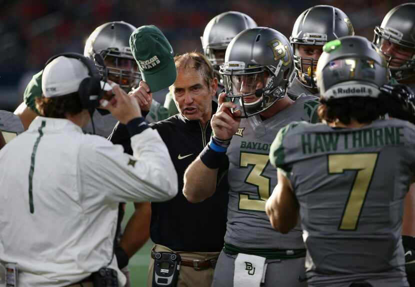 Baylor Bears head coach Art Briles speaks to players in the second half during an NCAA...