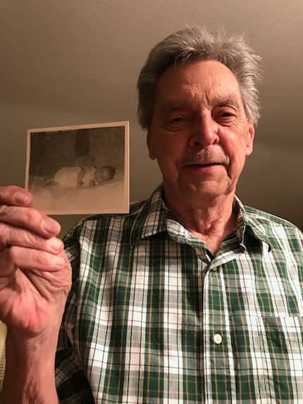 Gilbert Potyandy holds up a photo of Frisco resident Linda Rounds, a Korean adoptee, as a...