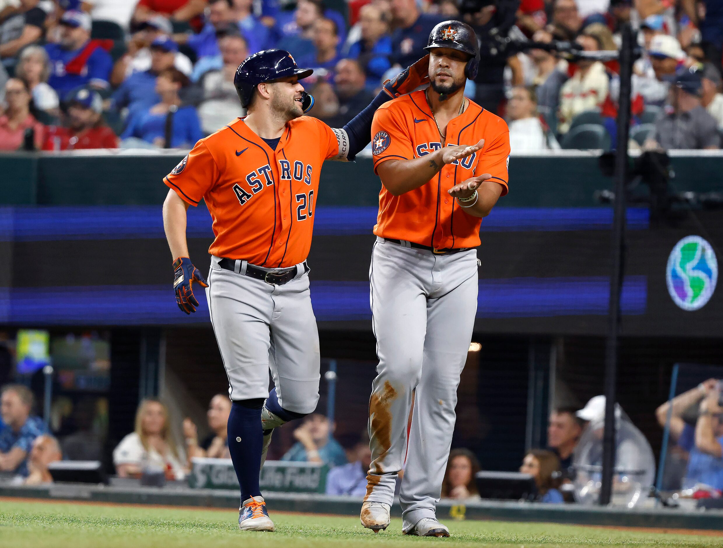 Houston Astros left fielder Chas McCormick (20) taps teammate Jose Abreu (79)  on the head...