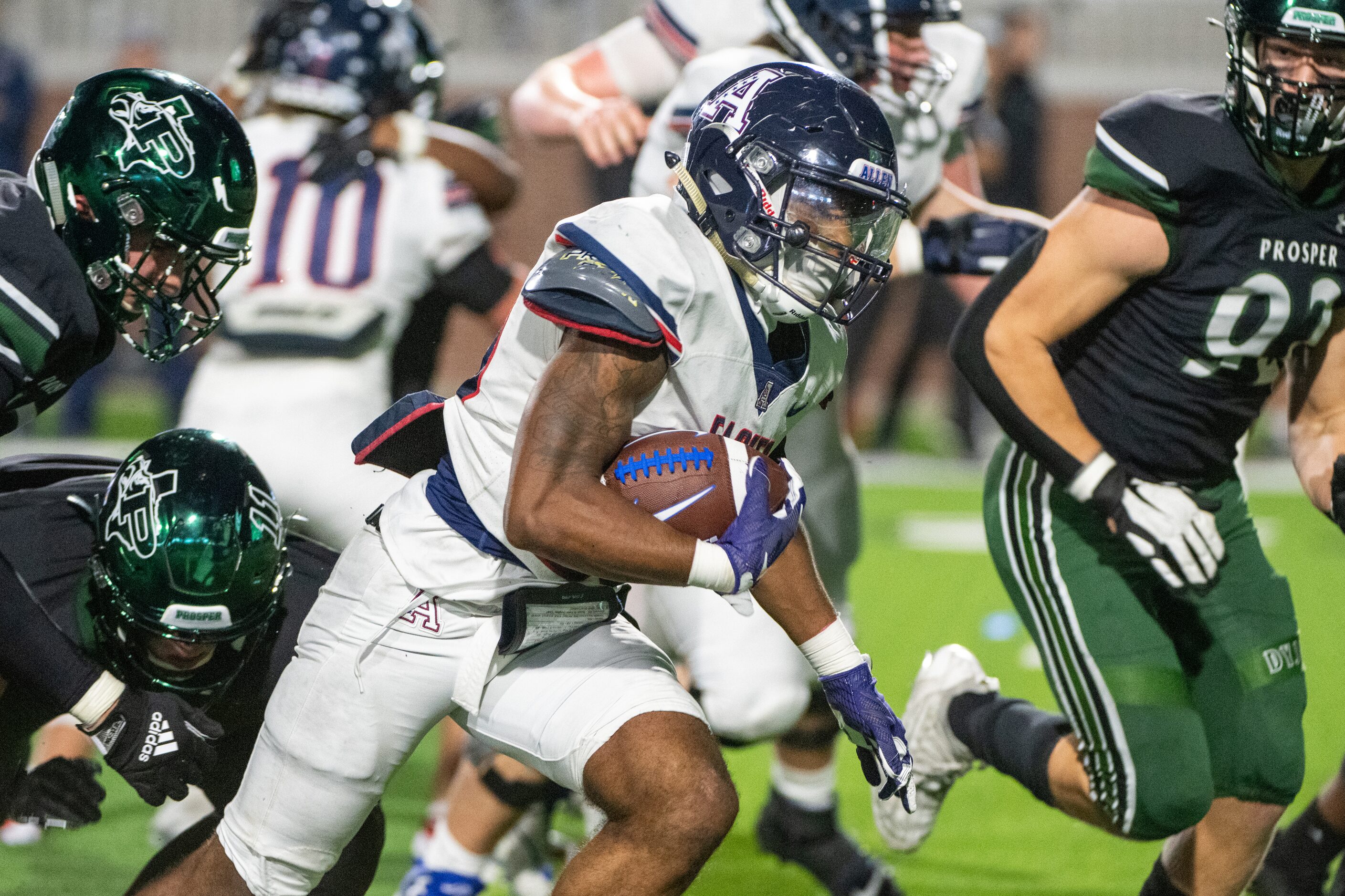 Allen’s running back Micah Ellis (23) runs through the Prosper defense in the second half...