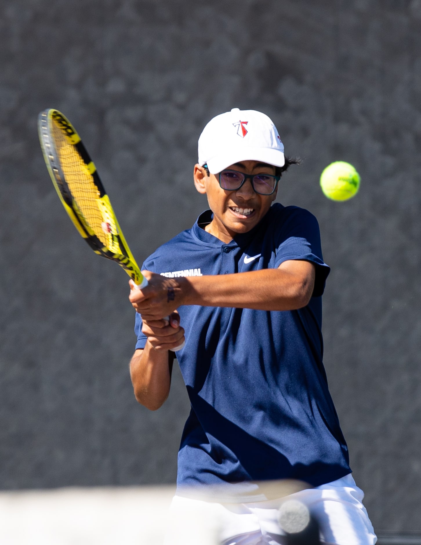 Frisco Centennial’s Akshay Kommineni returns a shot during a mixed doubles match with...