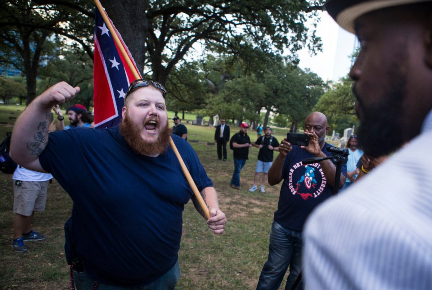 A counter-protester who declined to provide his name clashed with Pastor Michael W. Waters...