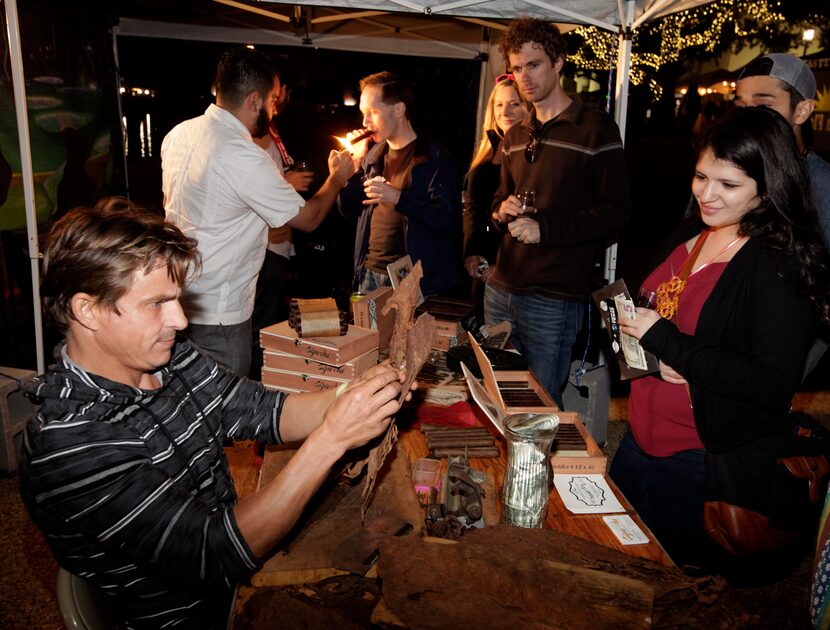 Yordy Mendez, left, rolls cigars. (Jason Janik/Special Contributor)