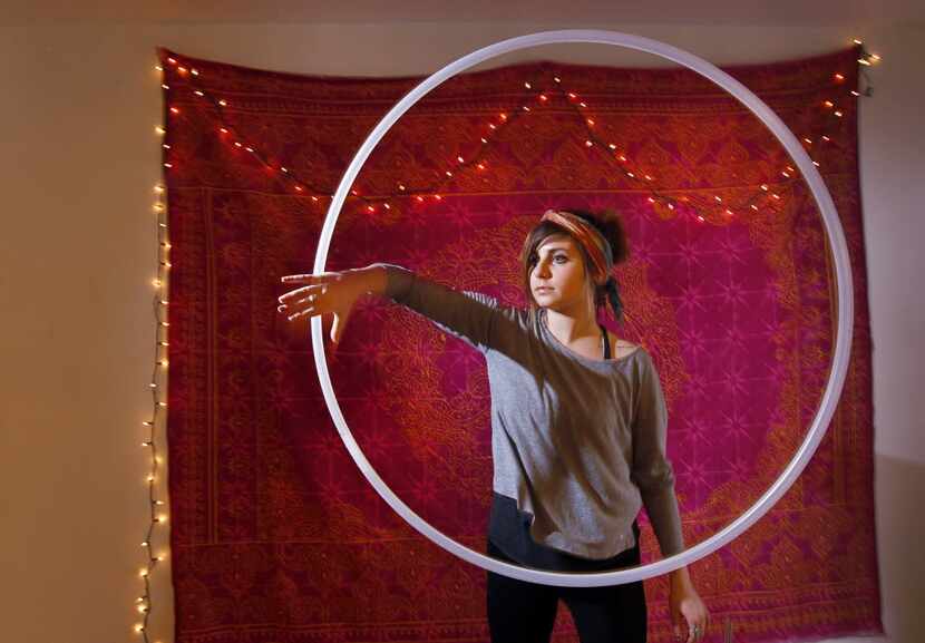 Tara Hughes demonstrates "hoop dancing," at her home in Argyle in February, 2014.