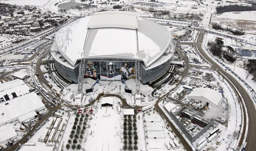 Cowboys Stadium and the surrounding area are blanketed by snow and ice on Friday, February...