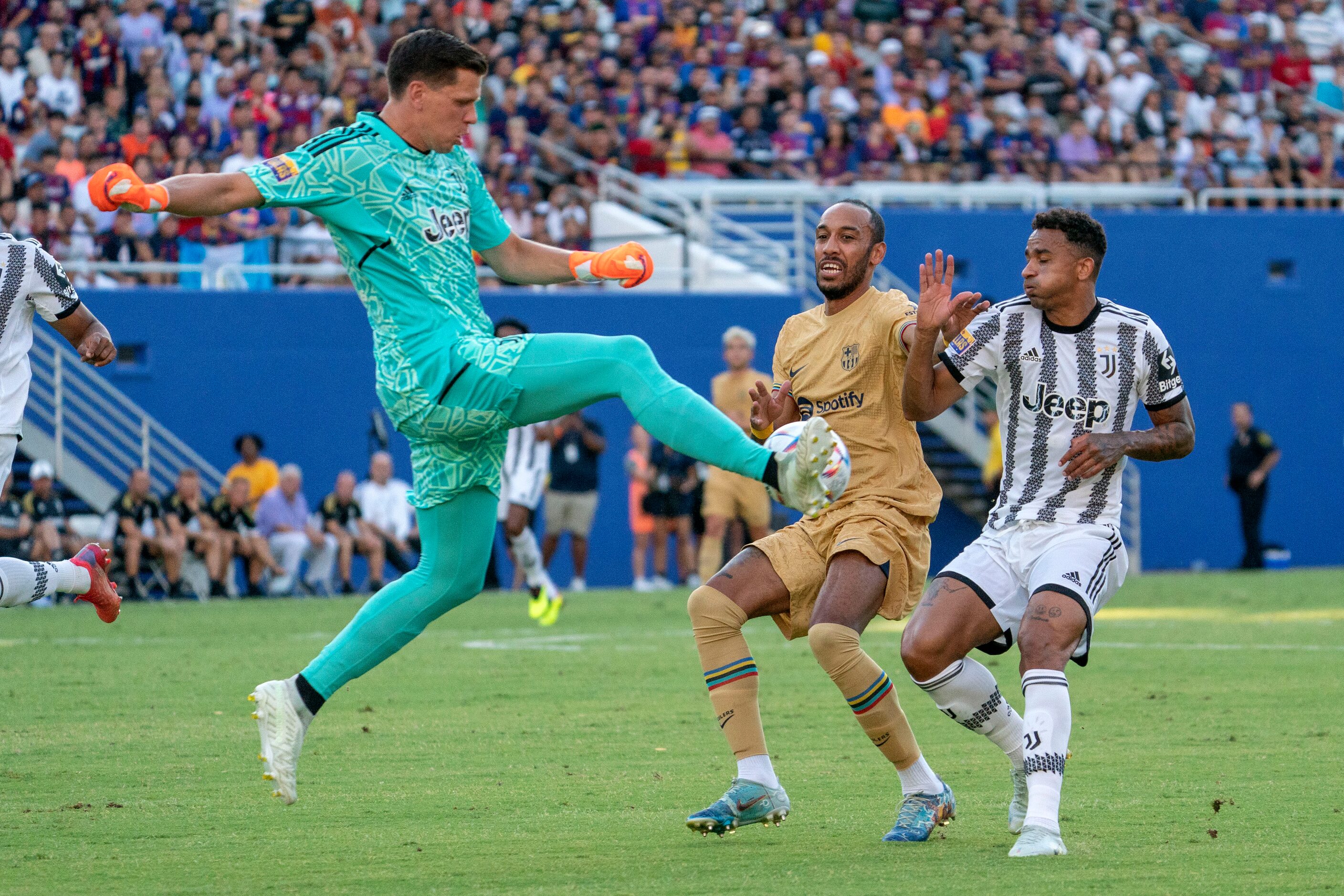 Juventus goalkeeper Wojciech Szczęsny (1) clears the ball away from Barcelona forward Pierre...