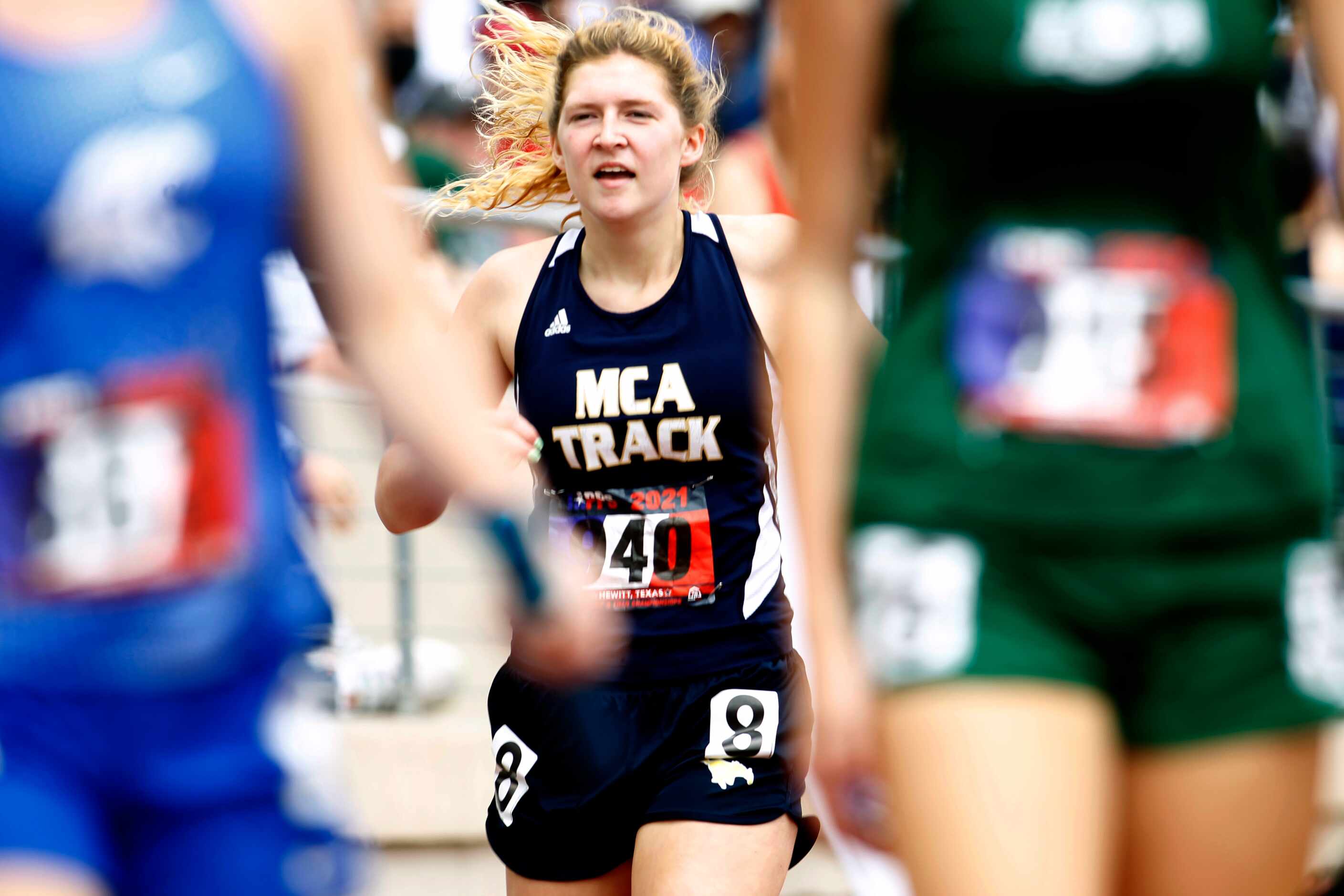 McKinney Christian's Georgia Haggard competes as part of her school's Class 5A Women 4X200...