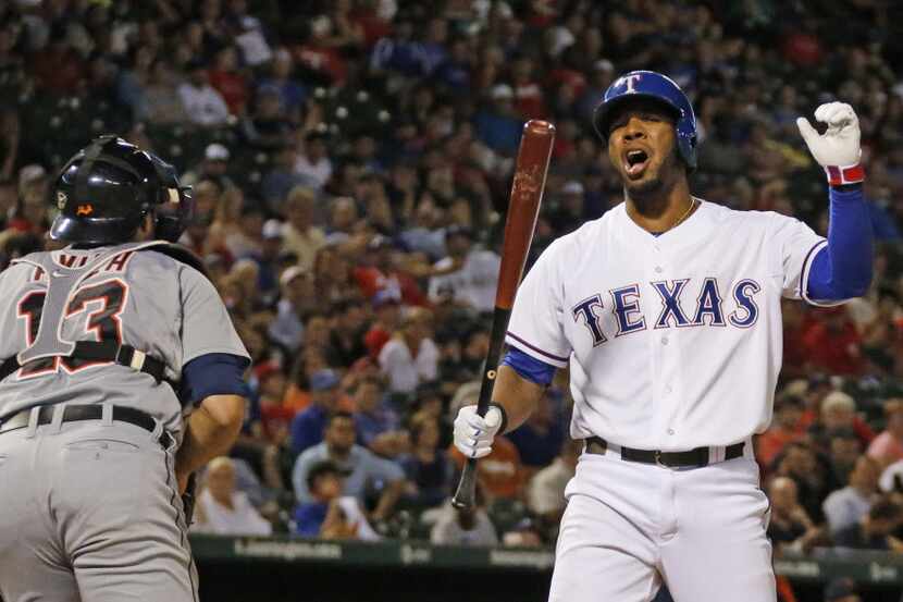 Texas shortstop Elvis Andrus reacts to being called out on strikes to end the seventh inning...